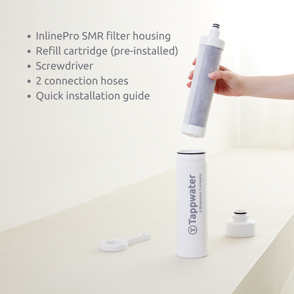 Tappwater filter housing with refill cartridge, screwdriver, and connection hoses on a white background.